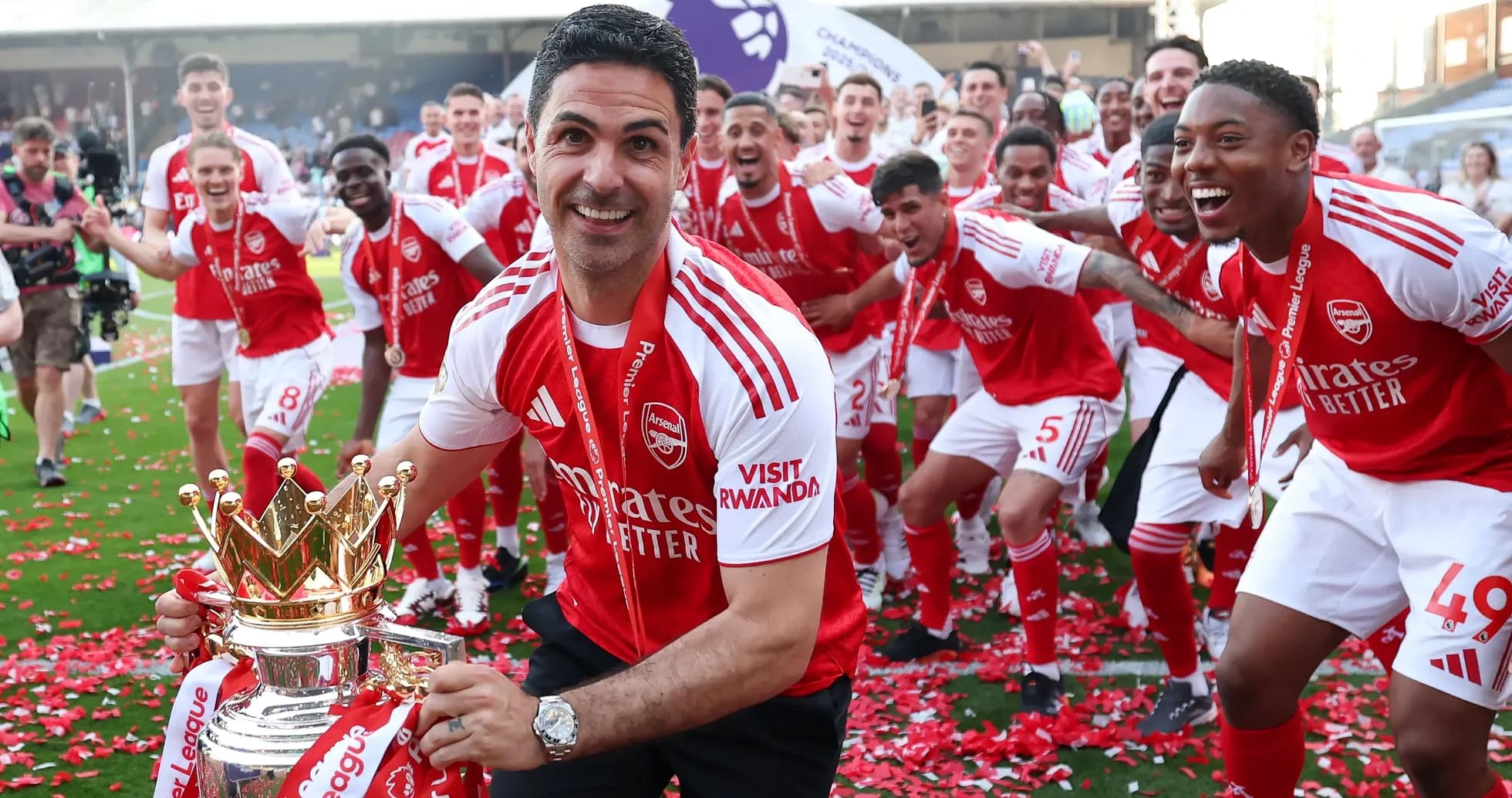 Arsenal players celebrating Premier League victory with trophy Arsenal players celebrating Premier League victory with trophy