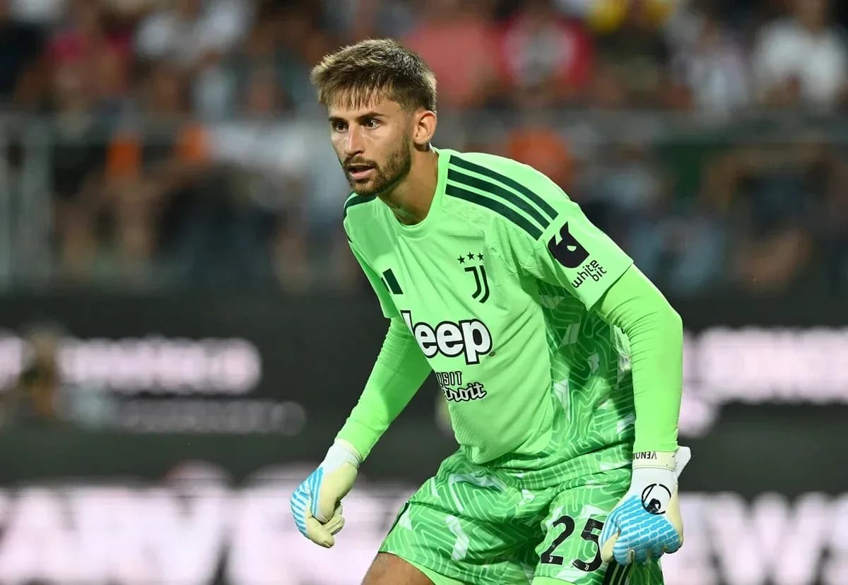 Goalkeeper in green Juventus kit preparing for play Goalkeeper in green Juventus kit preparing for play