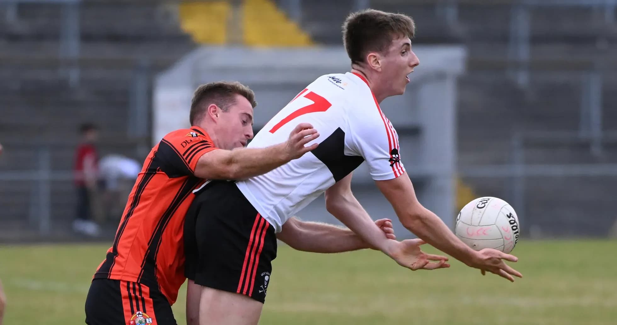 Two players competing for a ball in Gaelic football Two players competing for a ball in Gaelic football