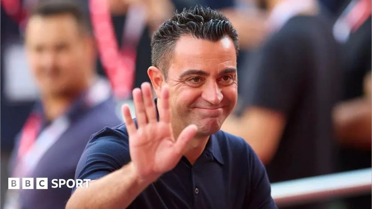 Coach waving while smiling at the event Coach waving while smiling at the event