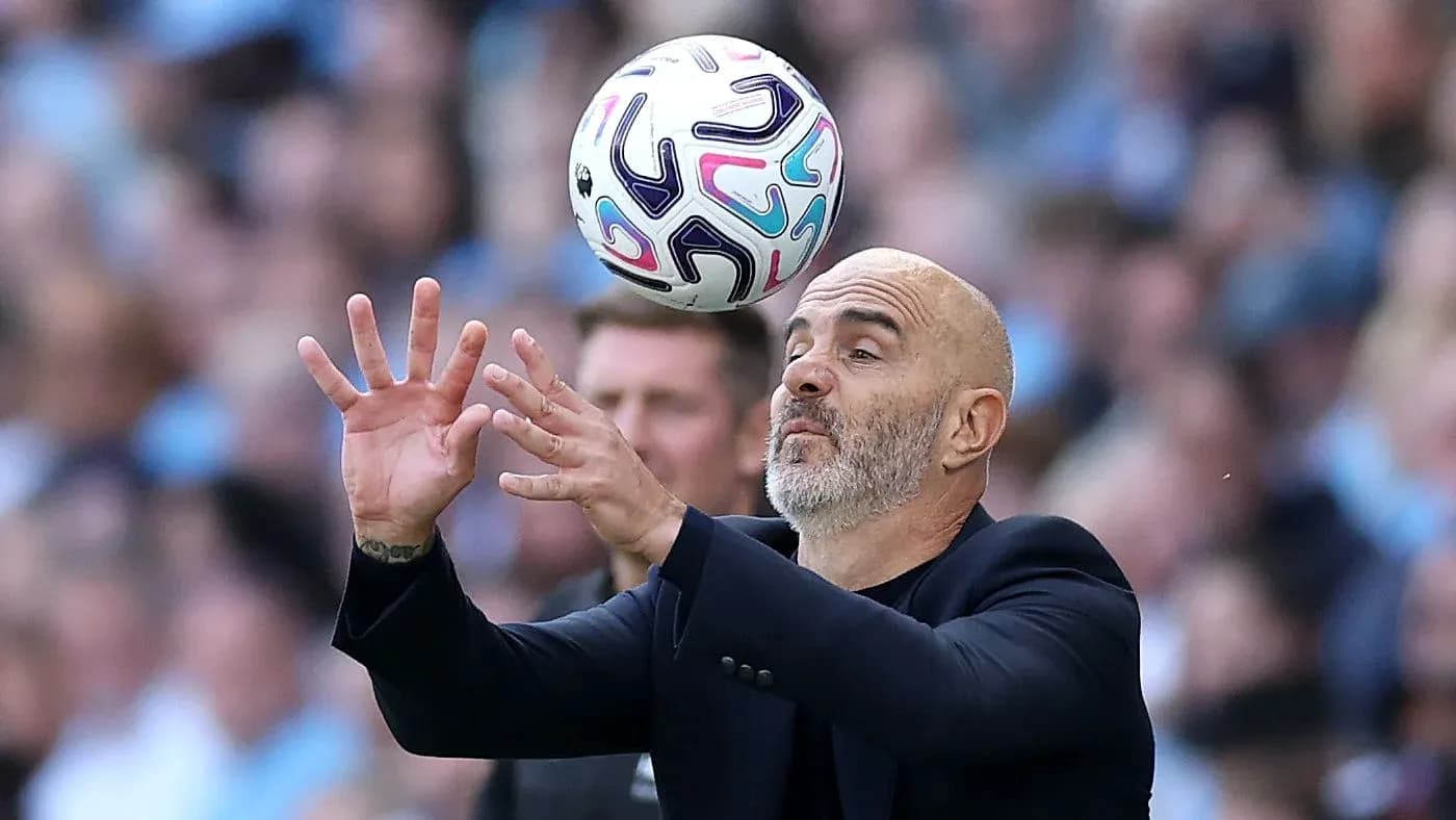 Coach attempting to catch a ball during match Coach attempting to catch a ball during match