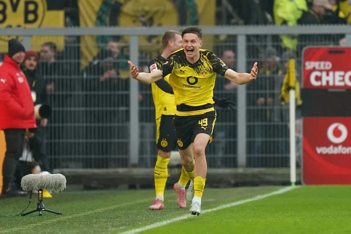 Player celebrating a goal for Borussia Dortmund Player celebrating a goal for Borussia Dortmund