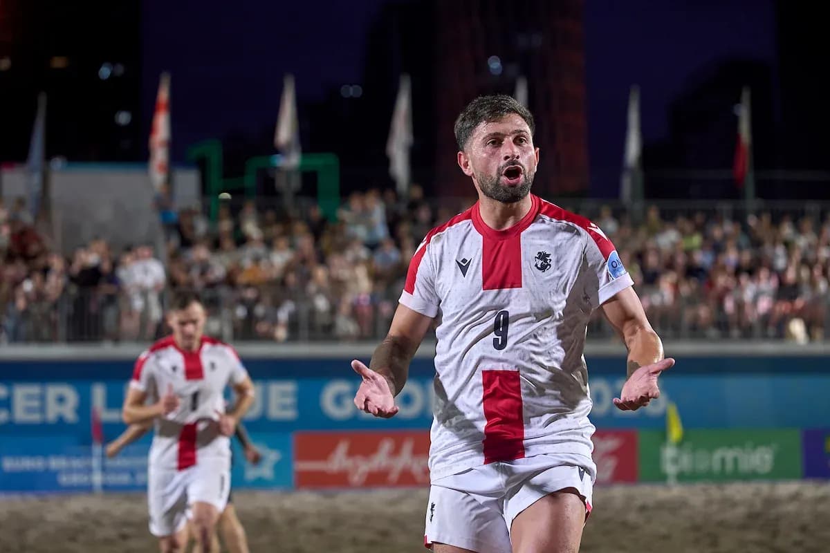 Player celebrating a goal during beach soccer match Player celebrating a goal during beach soccer match