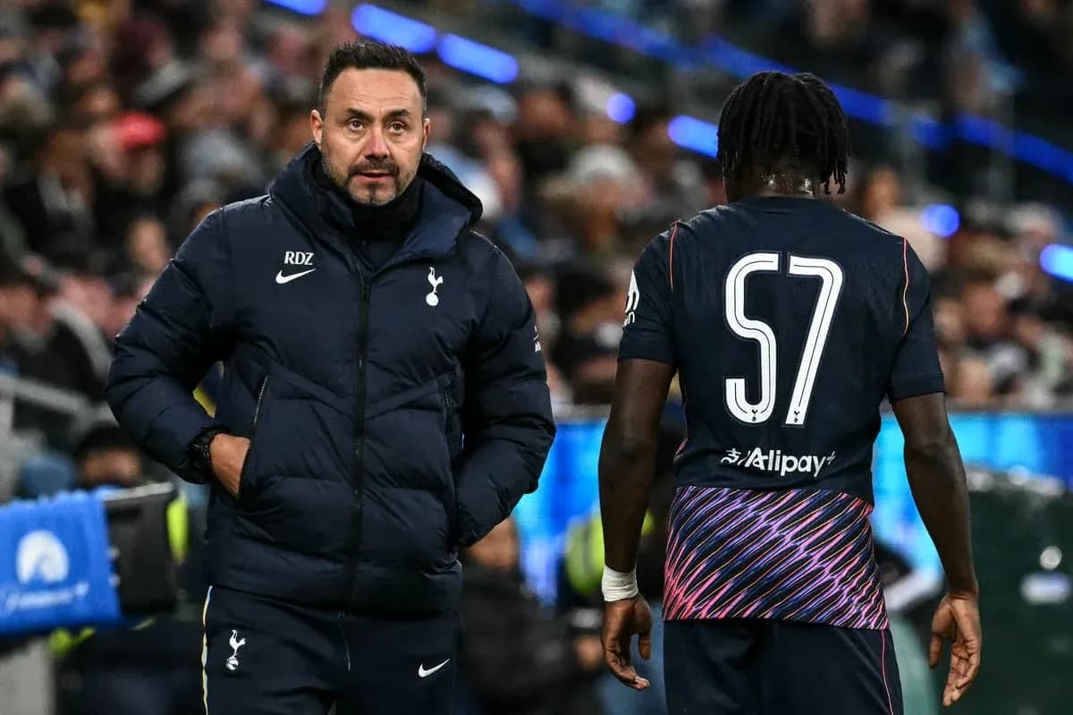 Manager discussing tactics with player during match Manager discussing tactics with player during match