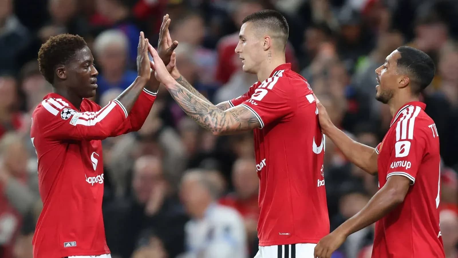 Players celebrating together during a match Players celebrating together during a match
