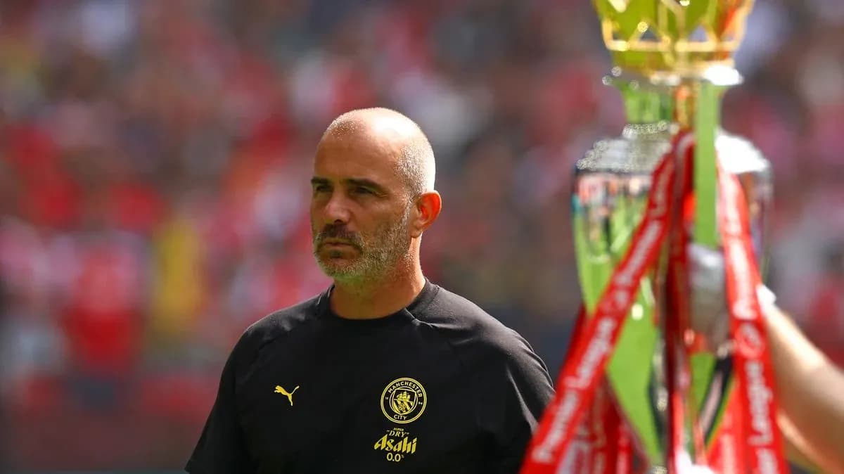 Coach observing trophy presentation before the match Coach observing trophy presentation before the match