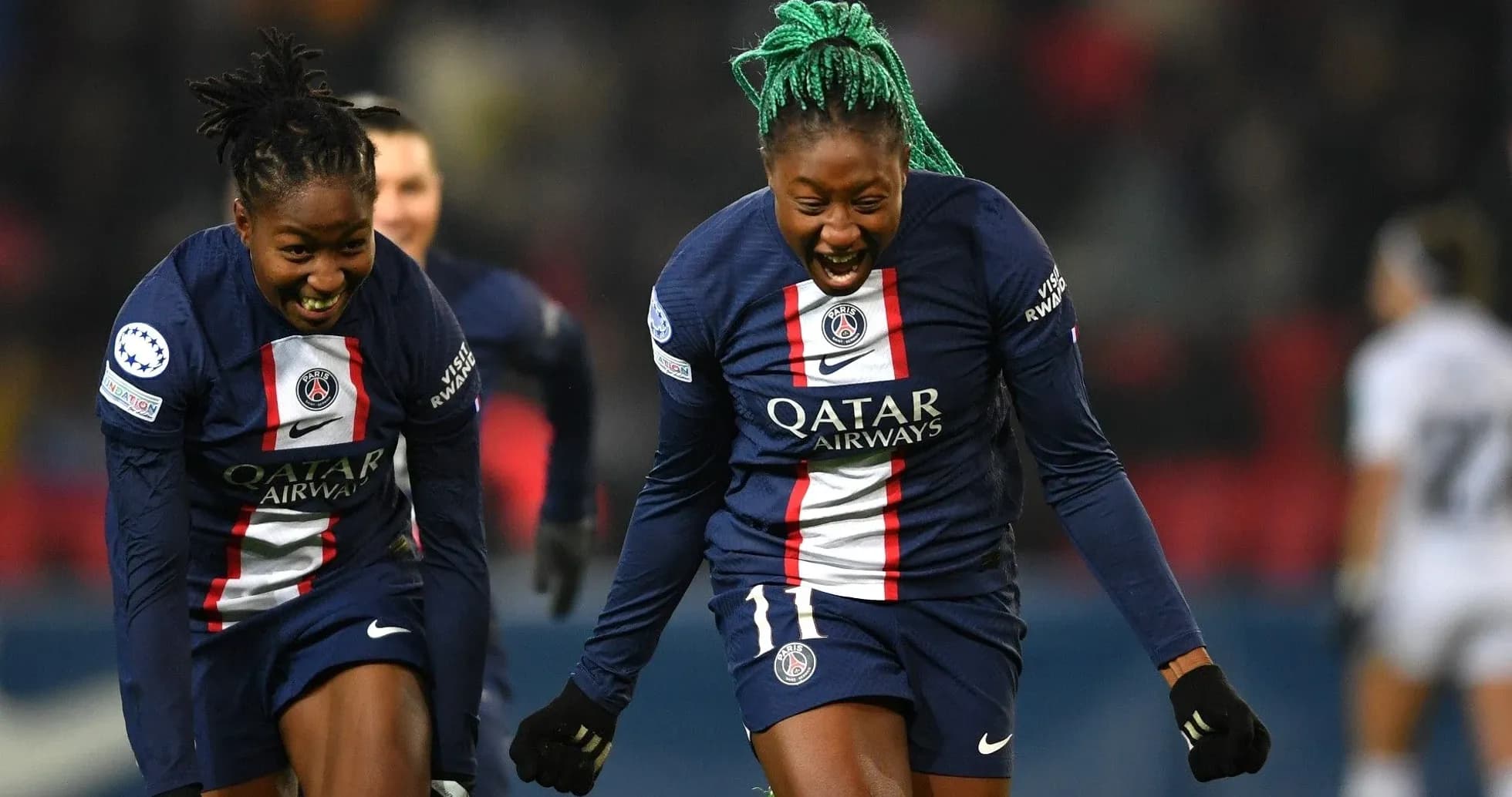Two PSG players celebrating a goal Two PSG players celebrating a goal