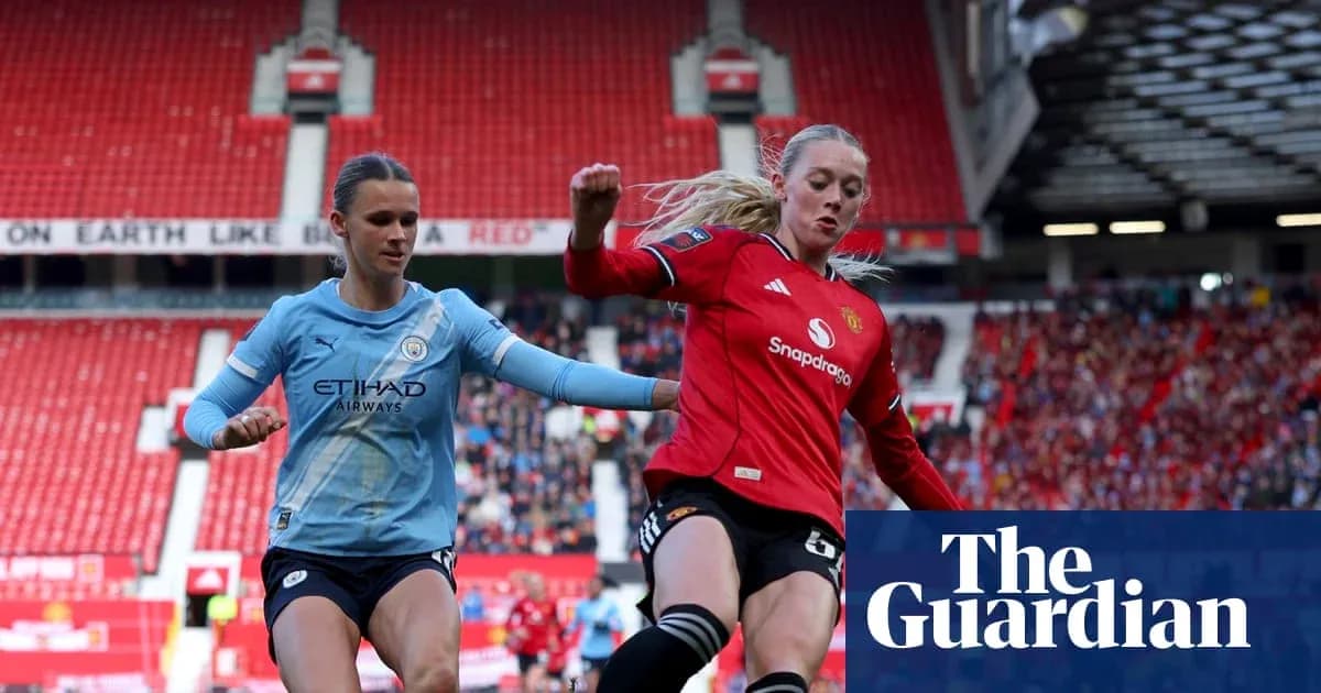 Manchester City player and Manchester United player competing Manchester City player and Manchester United player competing