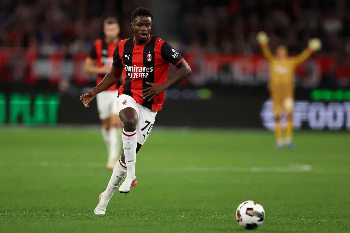 Player dribbling the ball during a match Player dribbling the ball during a match