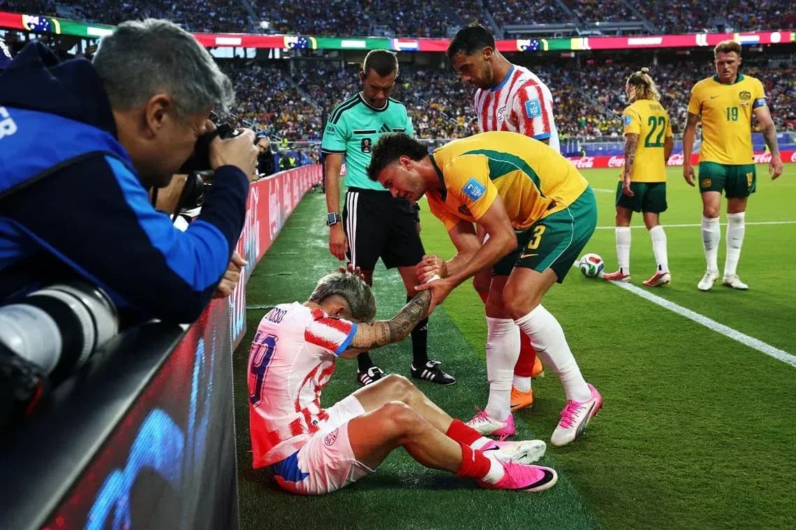 Player receiving assistance on the sidelines during match Player receiving assistance on the sidelines during match