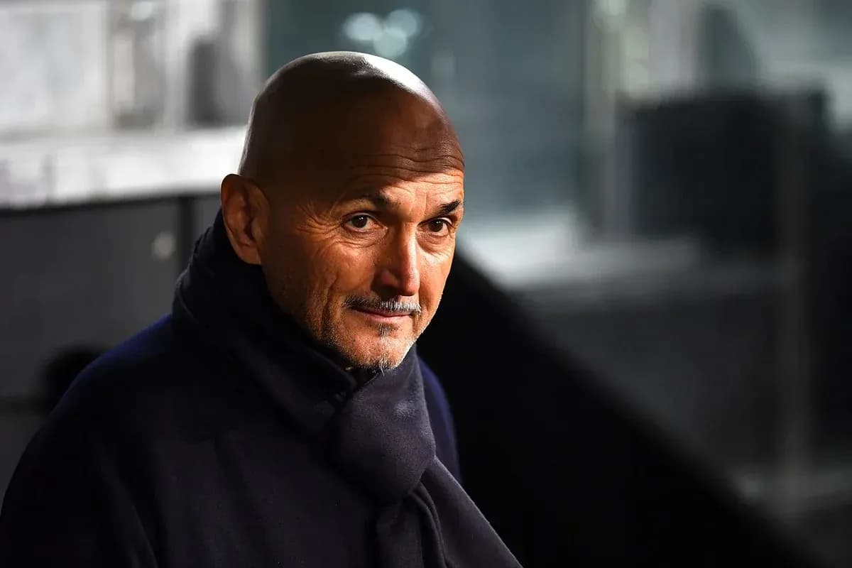 Coach wearing a dark scarf, looking thoughtfully Coach wearing a dark scarf, looking thoughtfully