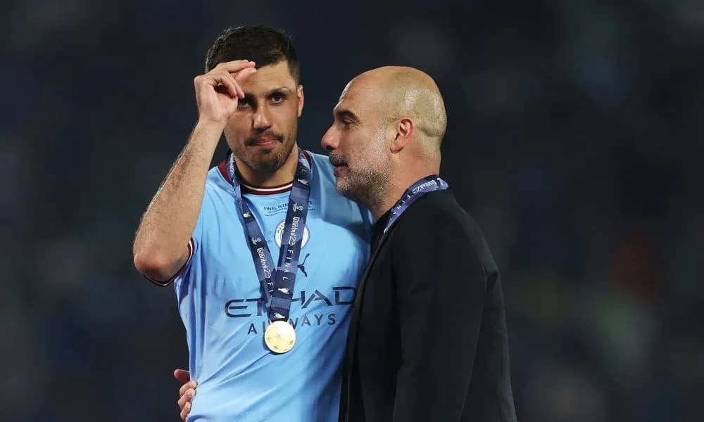 Player and coach celebrating post-match with medals Player and coach celebrating post-match with medals