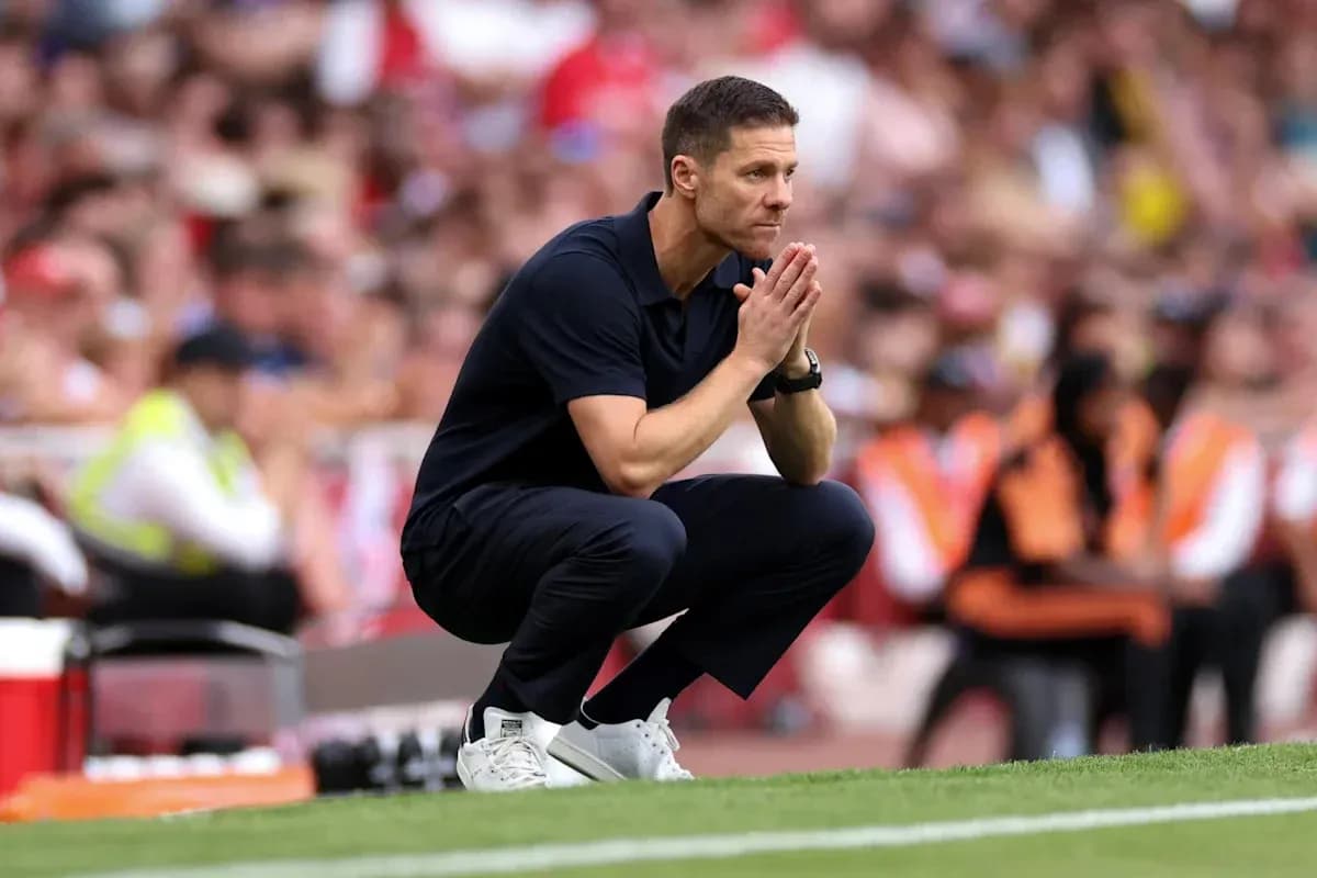 Coach crouched on sideline during match Coach crouched on sideline during match