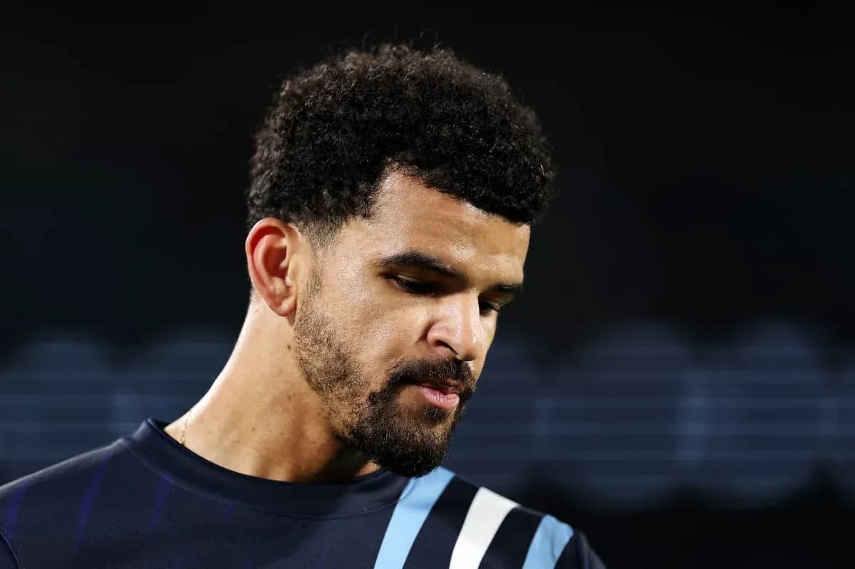 Player looking down during post-match reflection Player looking down during post-match reflection