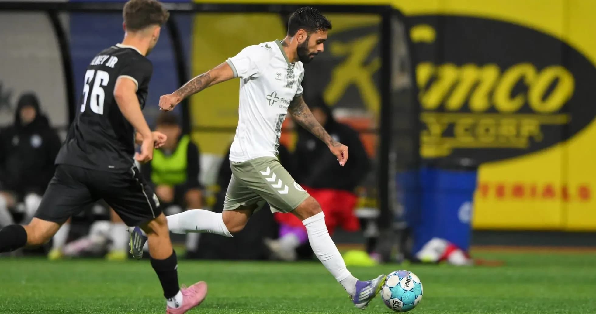 NY Cosmos player dribbling against Hartford Athletic NY Cosmos player dribbling against Hartford Athletic