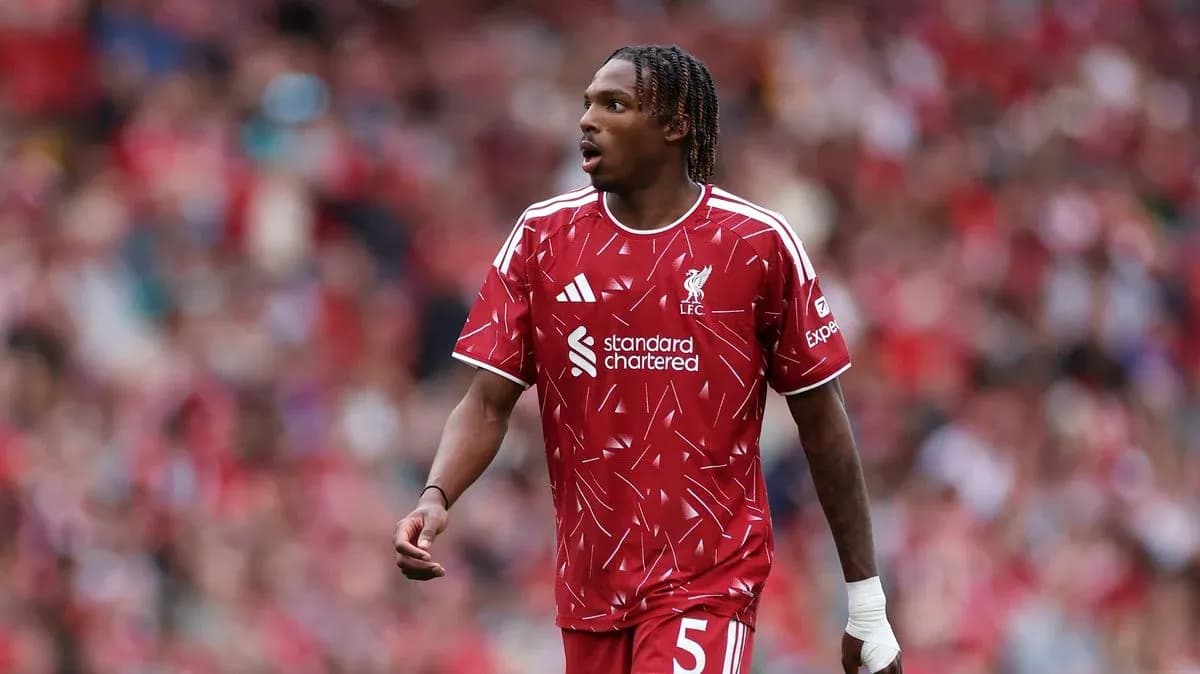 Player wearing Liverpool kit on the pitch Player wearing Liverpool kit on the pitch