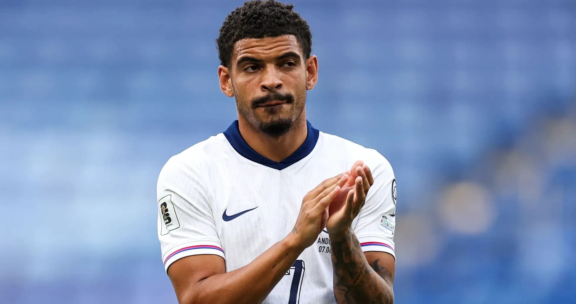 Football player applauding after a match Football player applauding after a match
