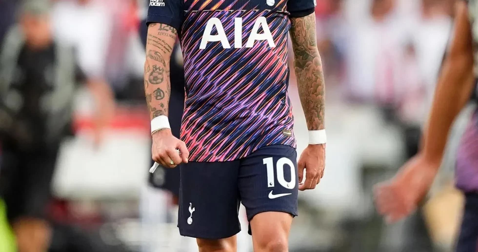 Player wearing Tottenham kit on the pitch Player wearing Tottenham kit on the pitch