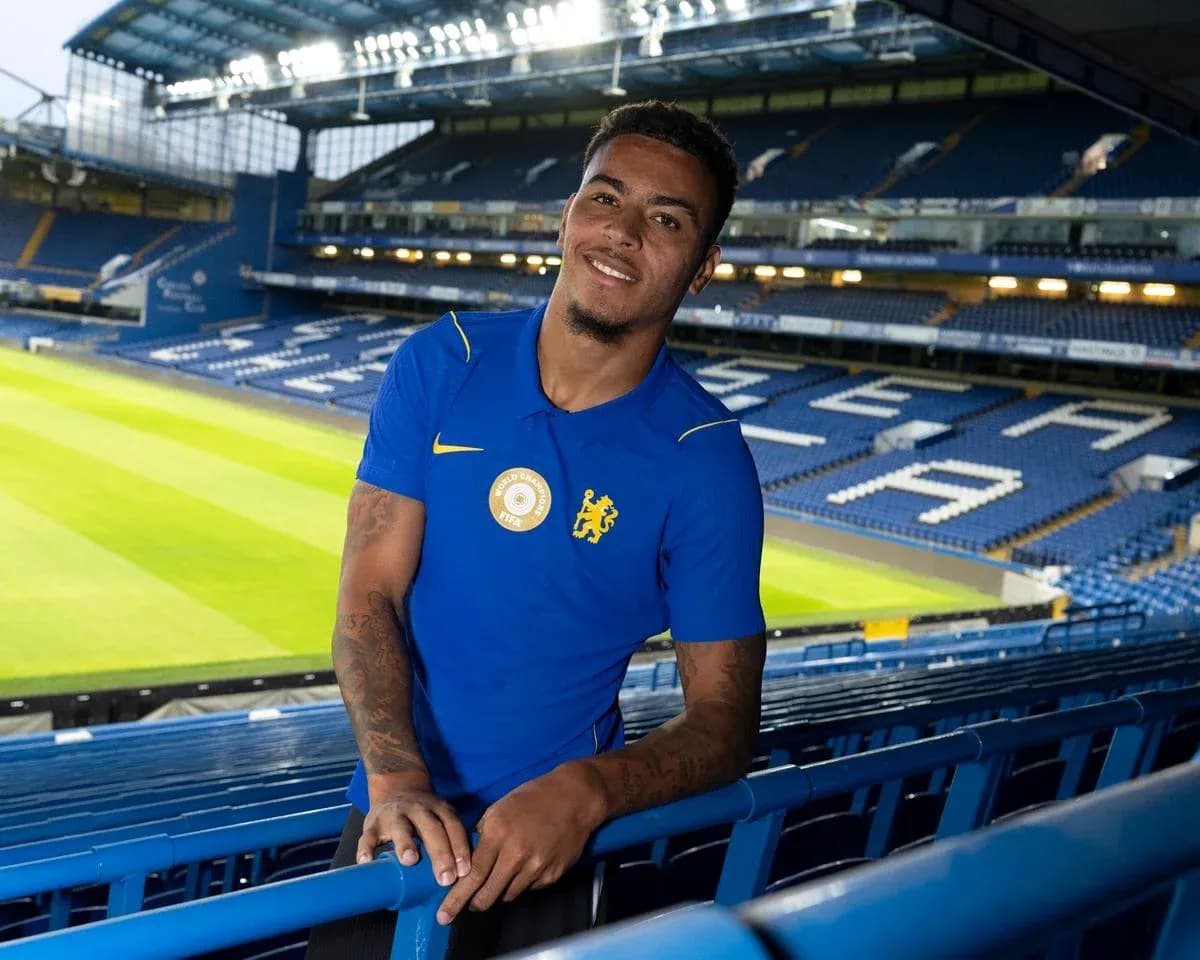 Player posing at Stamford Bridge stadium Player posing at Stamford Bridge stadium