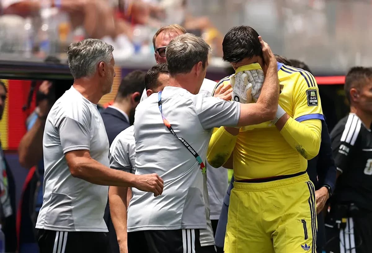 Goalkeeper receiving support from coaches on sideline Goalkeeper receiving support from coaches on sideline
