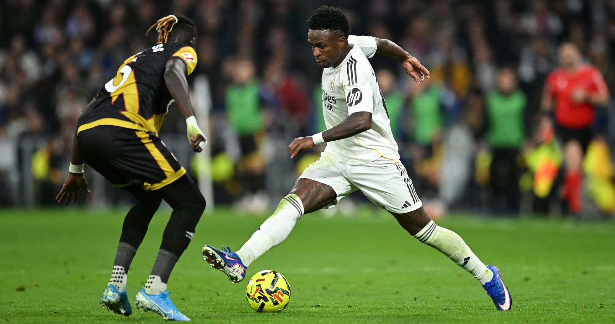 Vinicius Jr. dribbling against Rayo Vallecano player Vinicius Jr. dribbling against Rayo Vallecano player