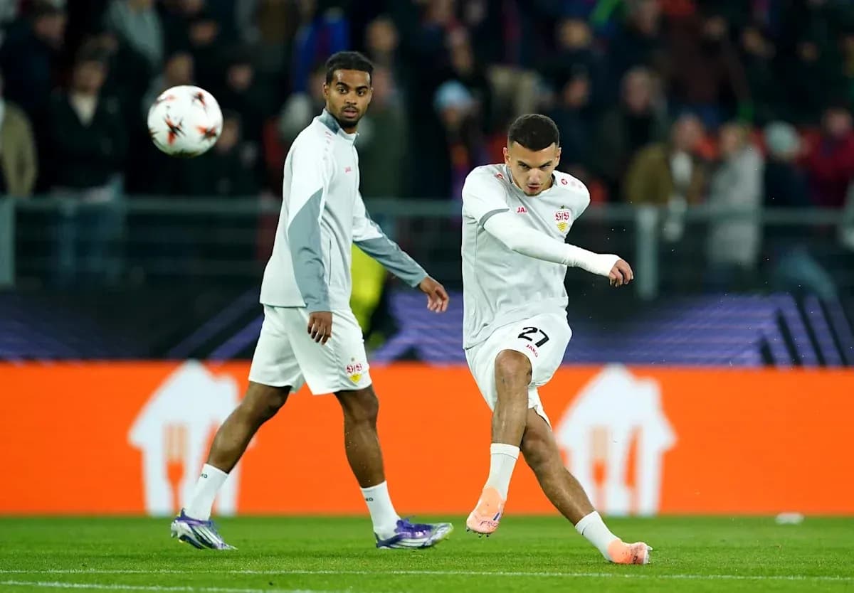 Player kicking the ball during warm-up session Player kicking the ball during warm-up session