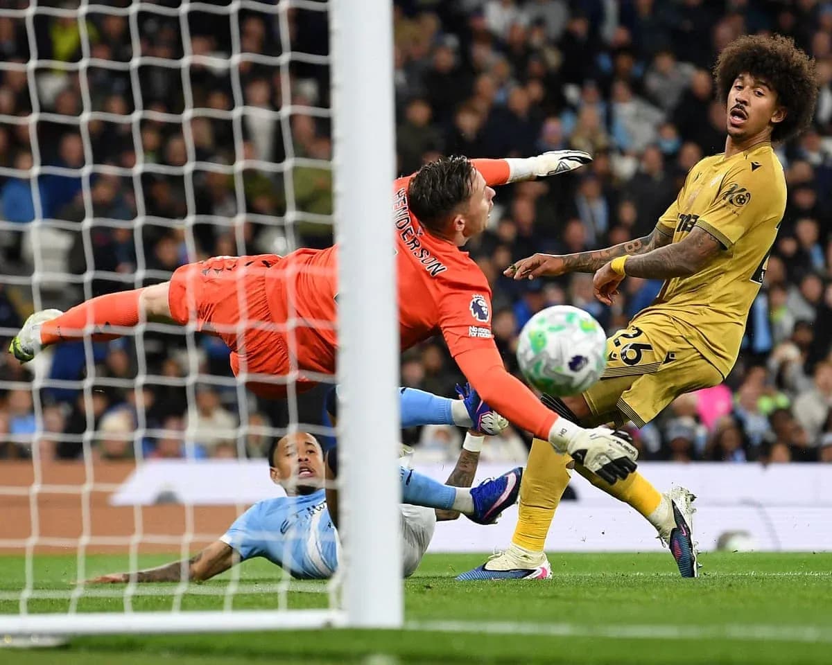 Goalkeeper diving to save shot during match Goalkeeper diving to save shot during match
