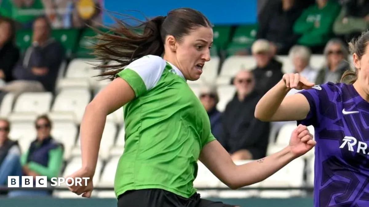 Player in green jersey dribbling the ball during match Player in green jersey dribbling the ball during match