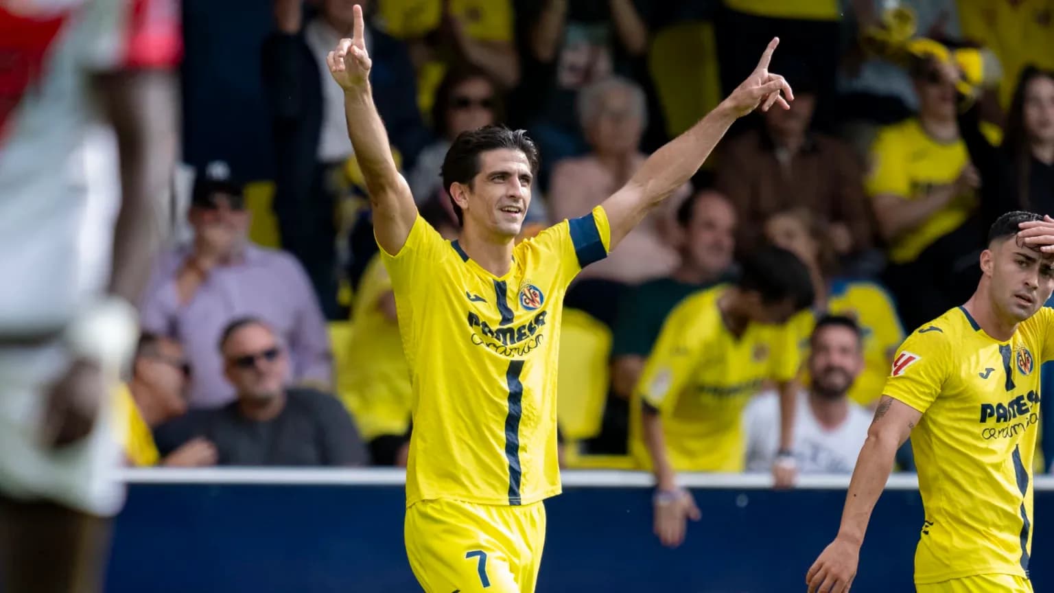 Villarreal player celebrating a goal in La Liga Villarreal player celebrating a goal in La Liga