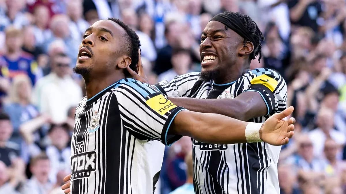 Newcastle players celebrating a goal together Newcastle players celebrating a goal together
