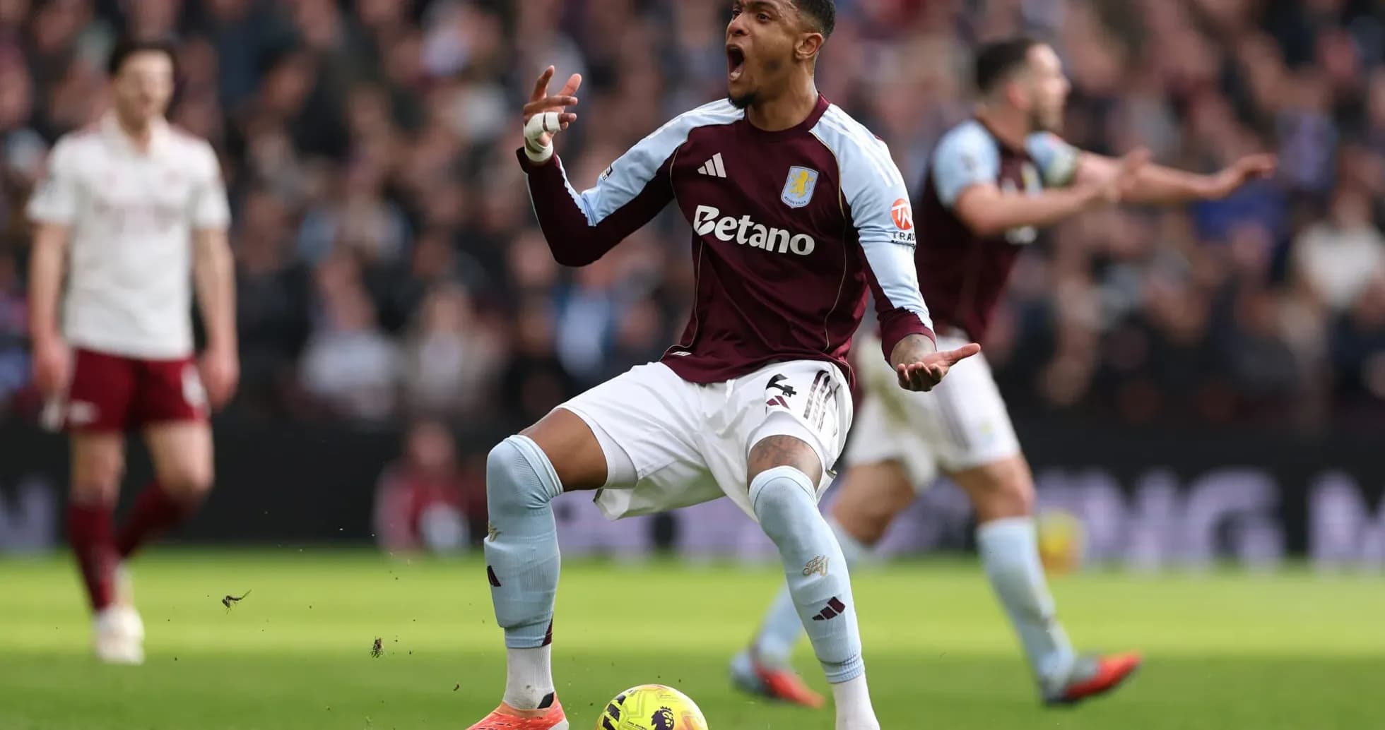 Aston Villa player celebrating during match Aston Villa player celebrating during match