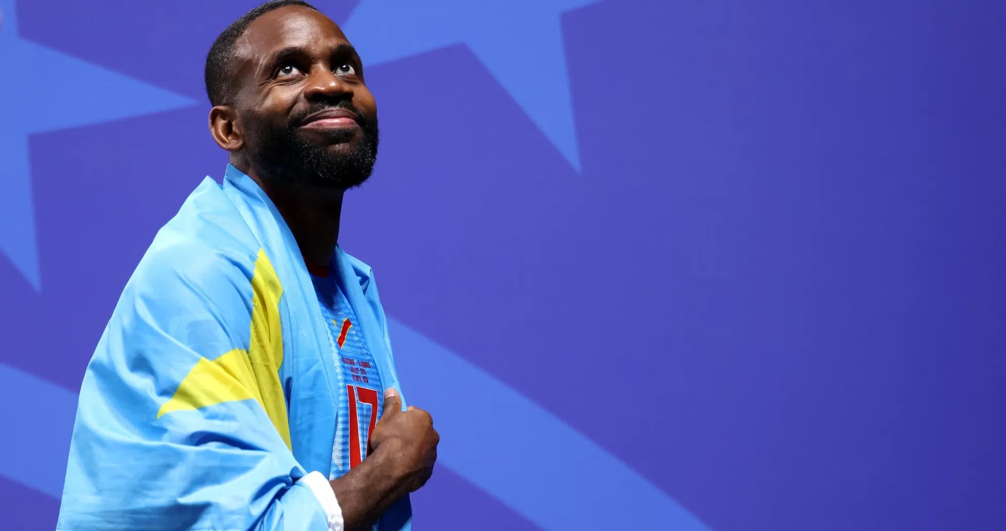 Athlete wearing national flag during event ceremony Athlete wearing national flag during event ceremony