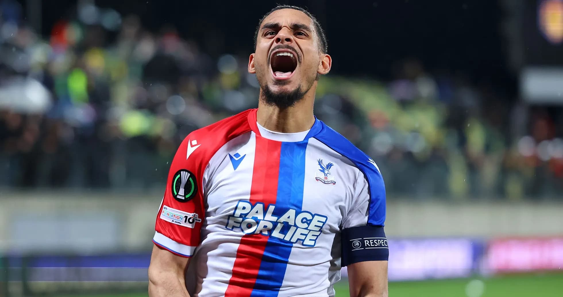 Player celebrating passionately after scoring a goal Player celebrating passionately after scoring a goal