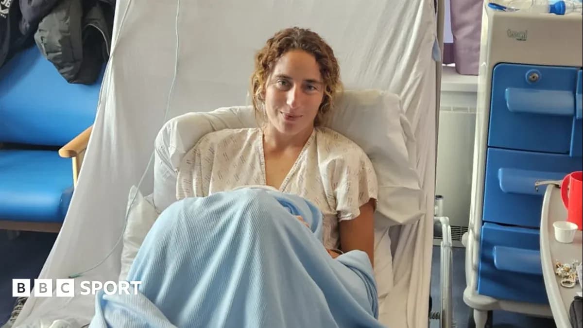 Athlete resting in hospital bed wearing gown Athlete resting in hospital bed wearing gown
