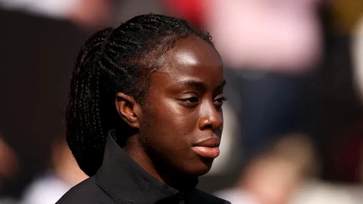 Athlete in black jacket during outdoor event Athlete in black jacket during outdoor event