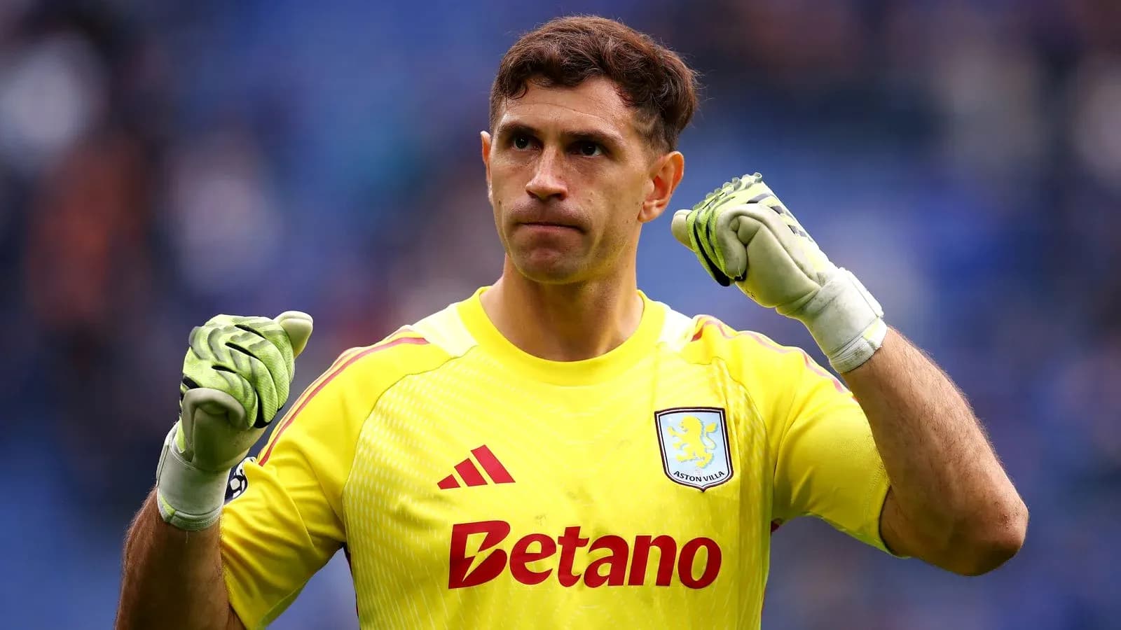 Goalkeeper celebrating with clenched fist in uniform Goalkeeper celebrating with clenched fist in uniform