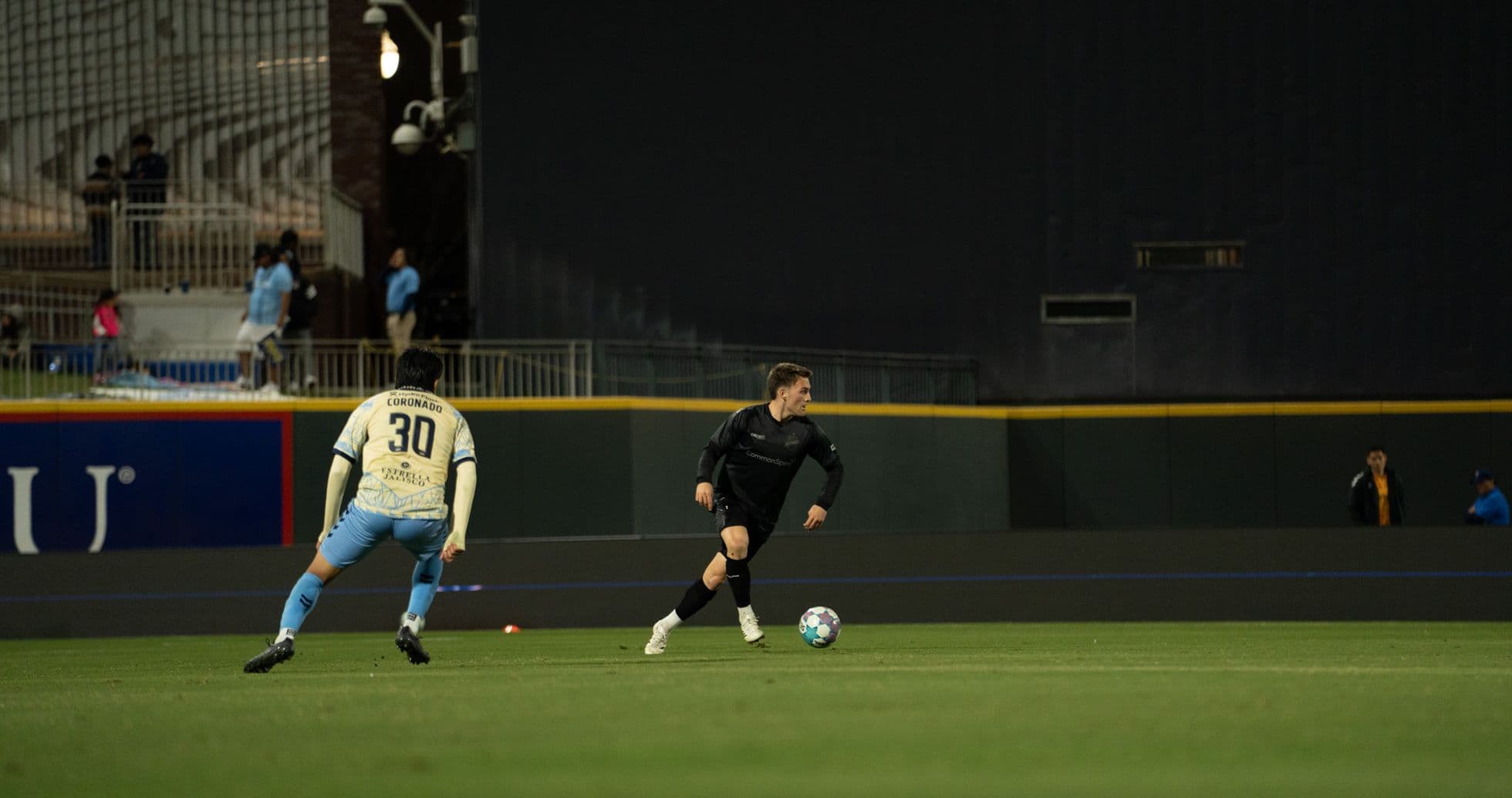 Player dribbling the ball during match Player dribbling the ball during match