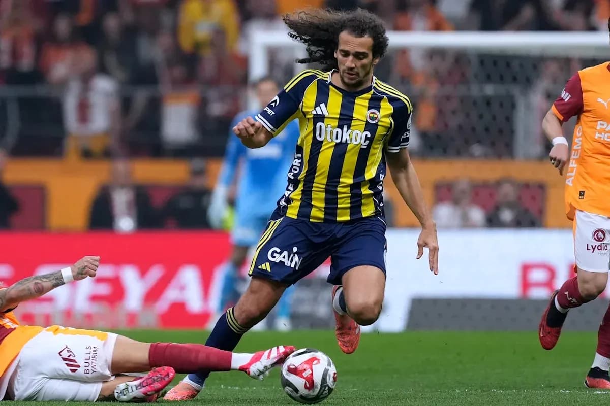 Fenerbahçe player dribbling past a defender during match Fenerbahçe player dribbling past a defender during match