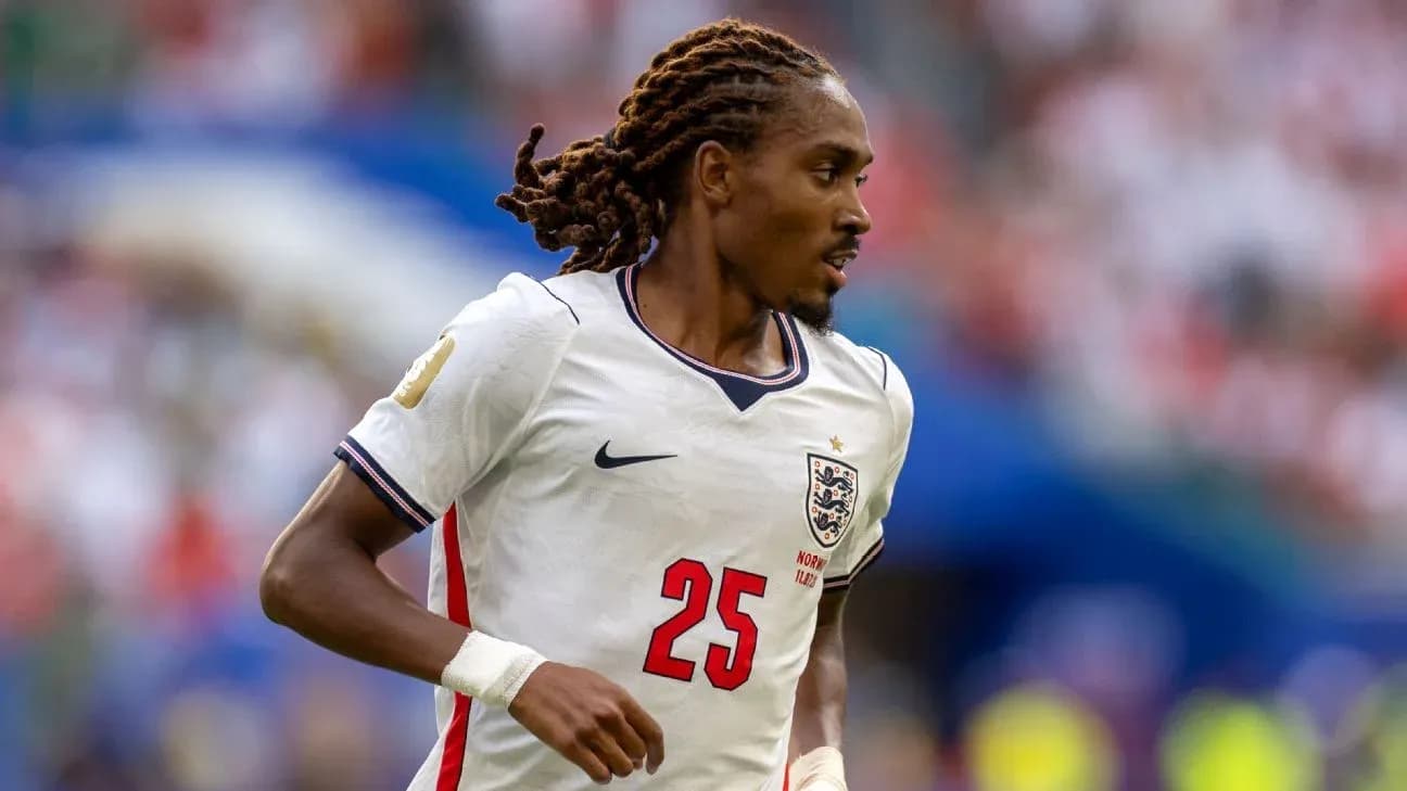 Player in England jersey running on the field Player in England jersey running on the field