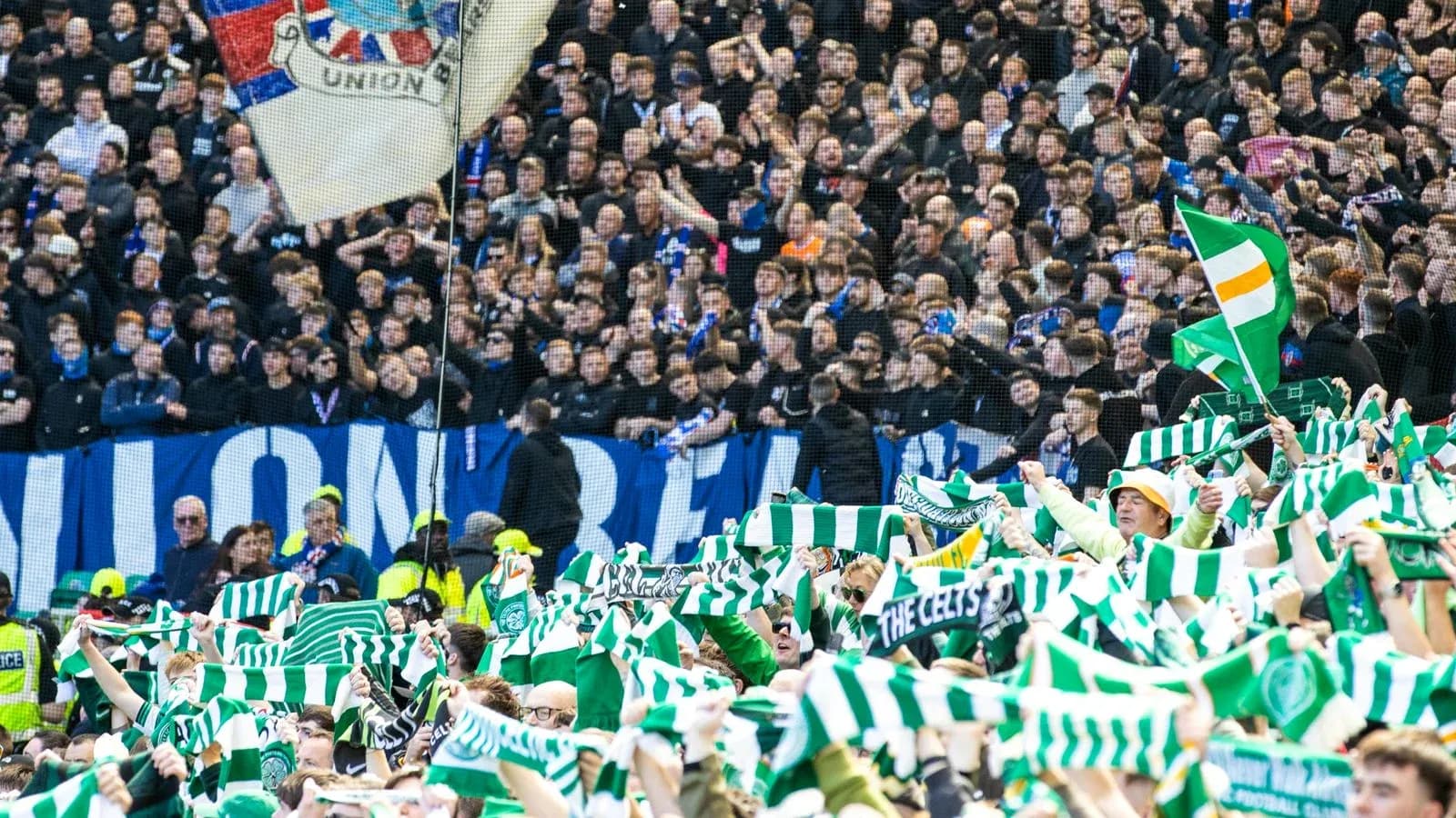 Celtic fans waving scarves in stadium crowd Celtic fans waving scarves in stadium crowd