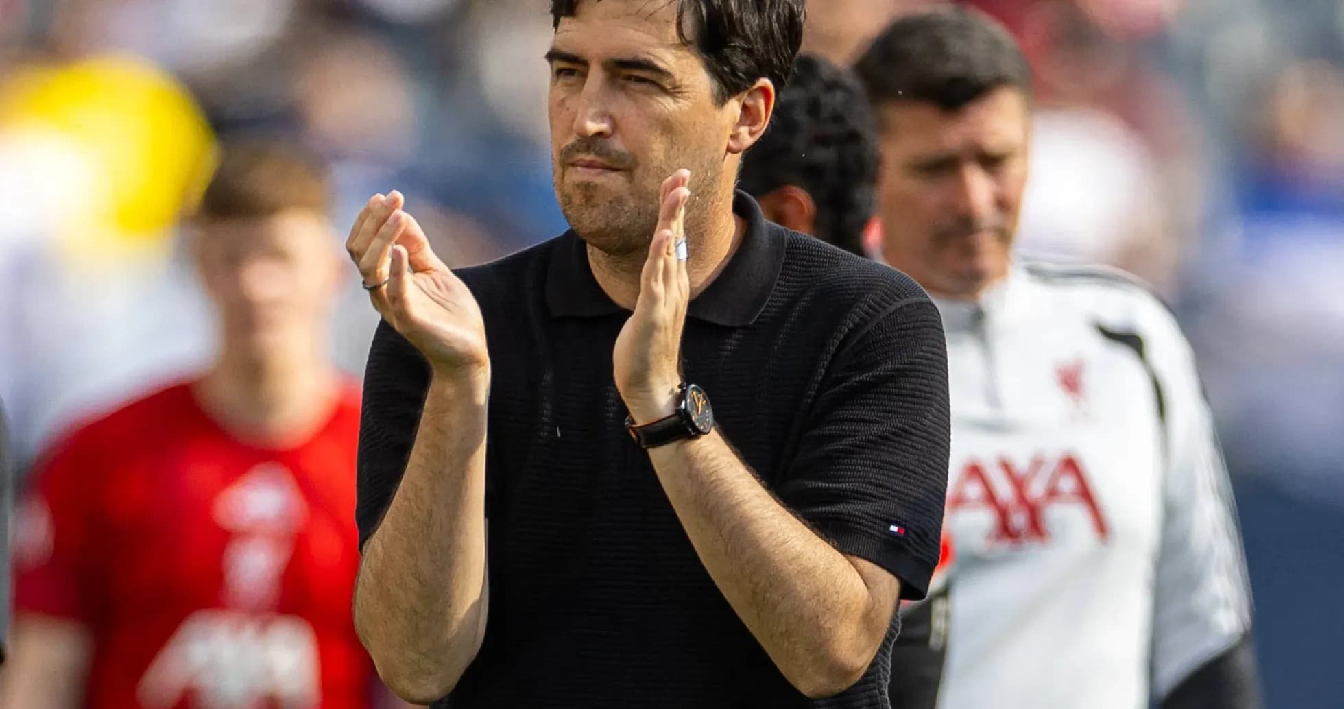 Coach applauding during a match at stadium Coach applauding during a match at stadium