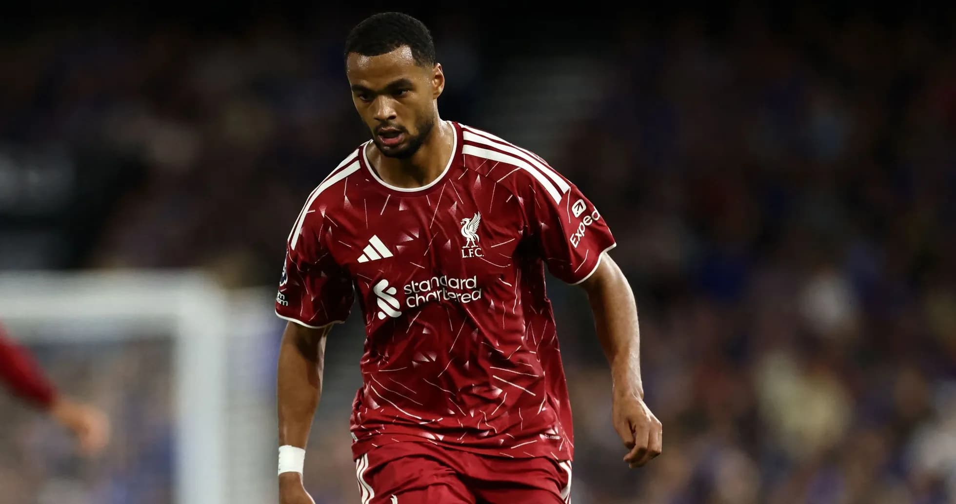 Player in Liverpool kit running during match Player in Liverpool kit running during match