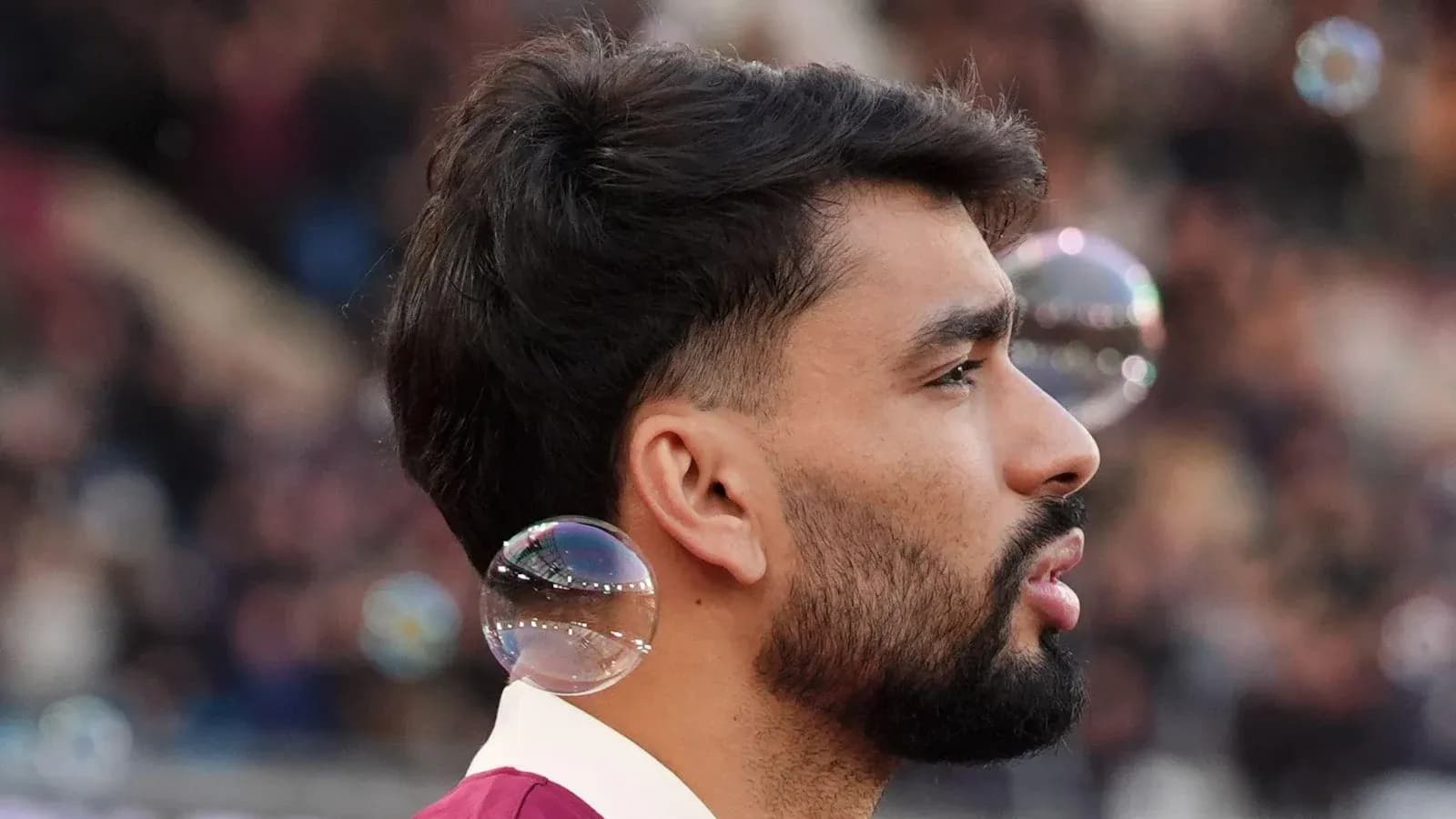 Player with bubbles during match warm-up Player with bubbles during match warm-up