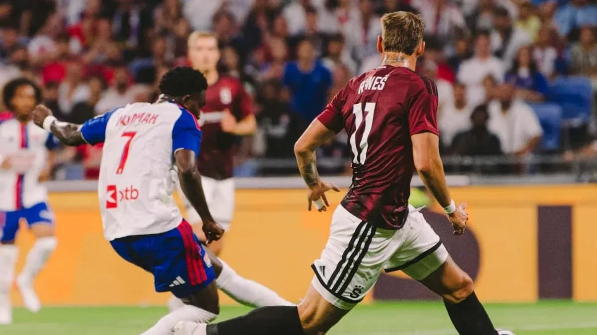 Lyon player tackling Sparta Praha opponent Lyon player tackling Sparta Praha opponent