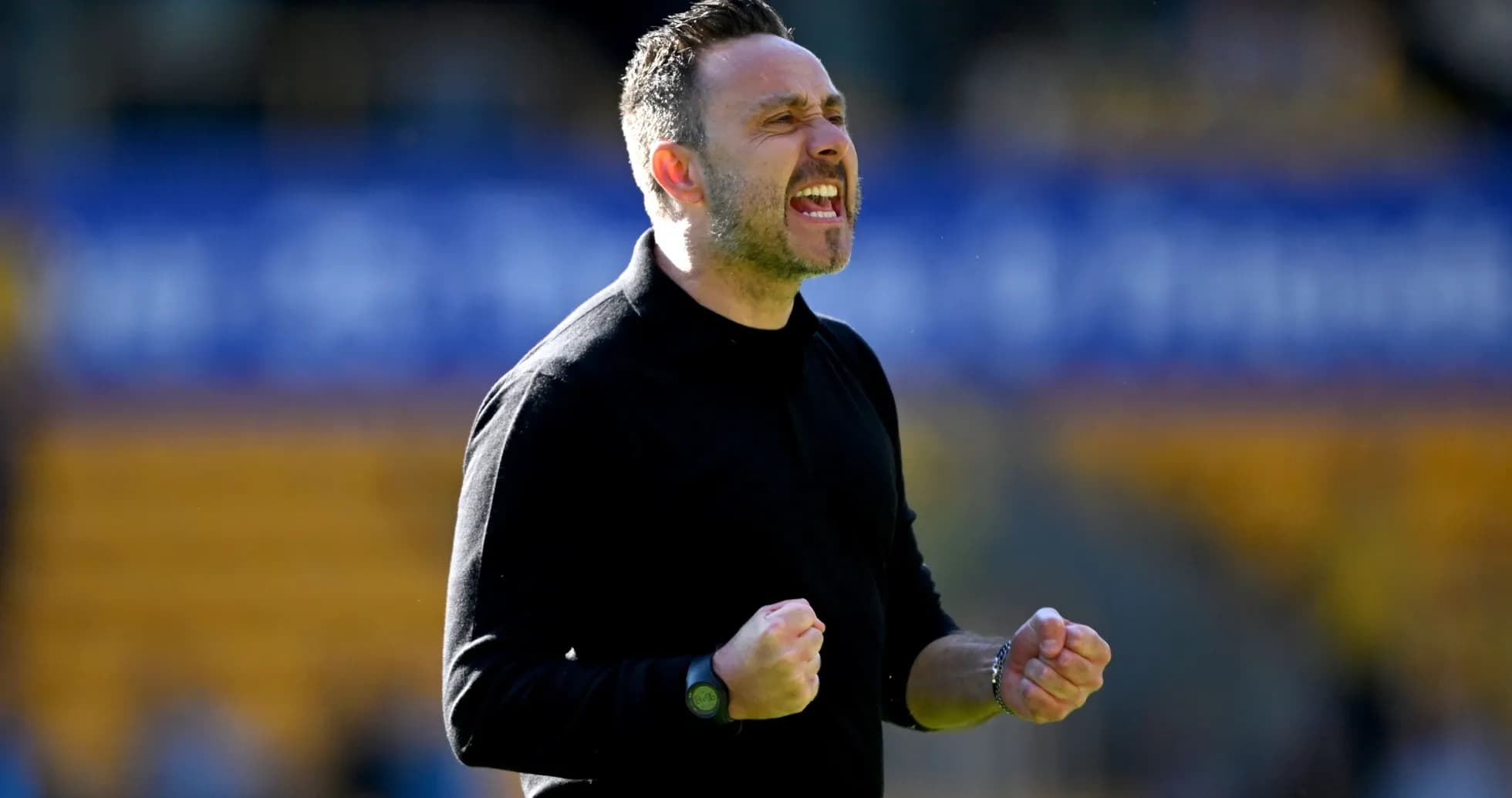 Coach celebrating passionately on the sidelines Coach celebrating passionately on the sidelines