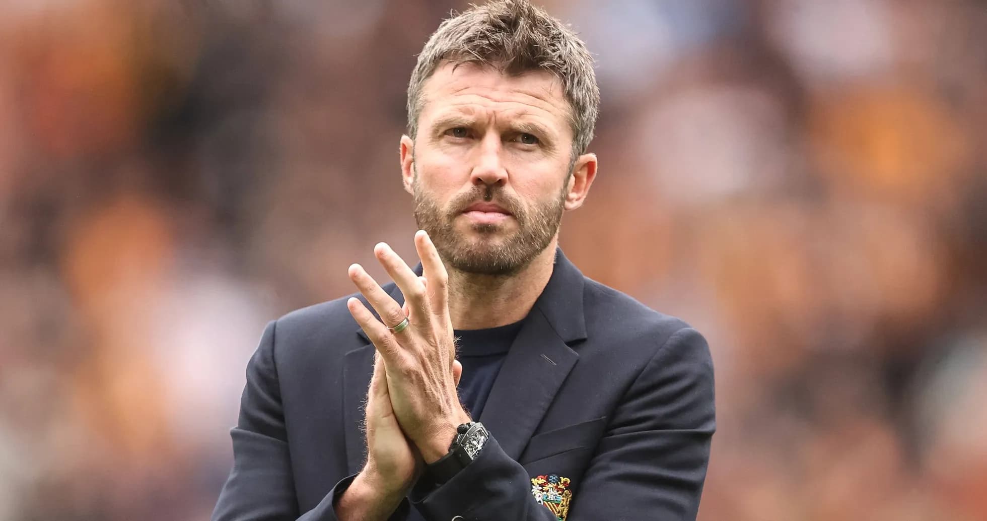 Manager applauding during a match on the sidelines Manager applauding during a match on the sidelines