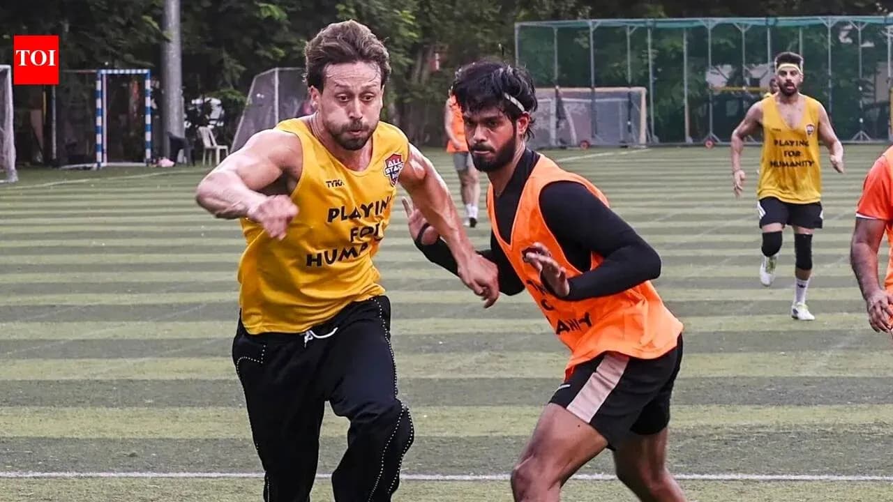 Two players sprinting during football training session Two players sprinting during football training session