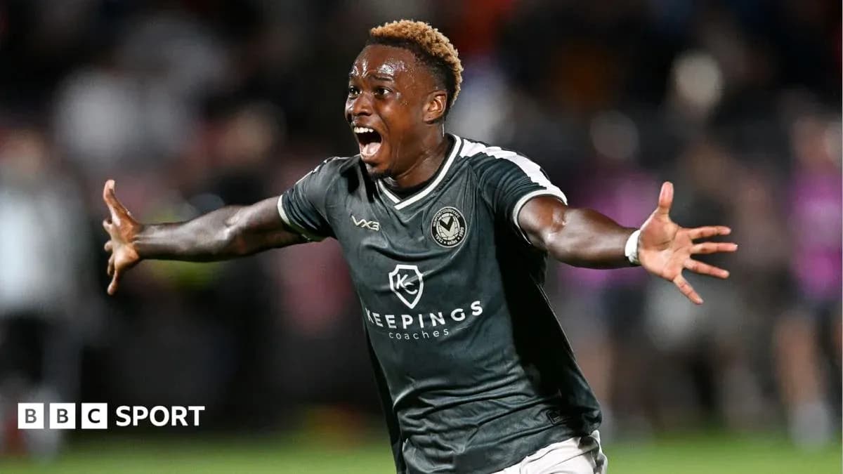 Player celebrating a goal in a football match Player celebrating a goal in a football match