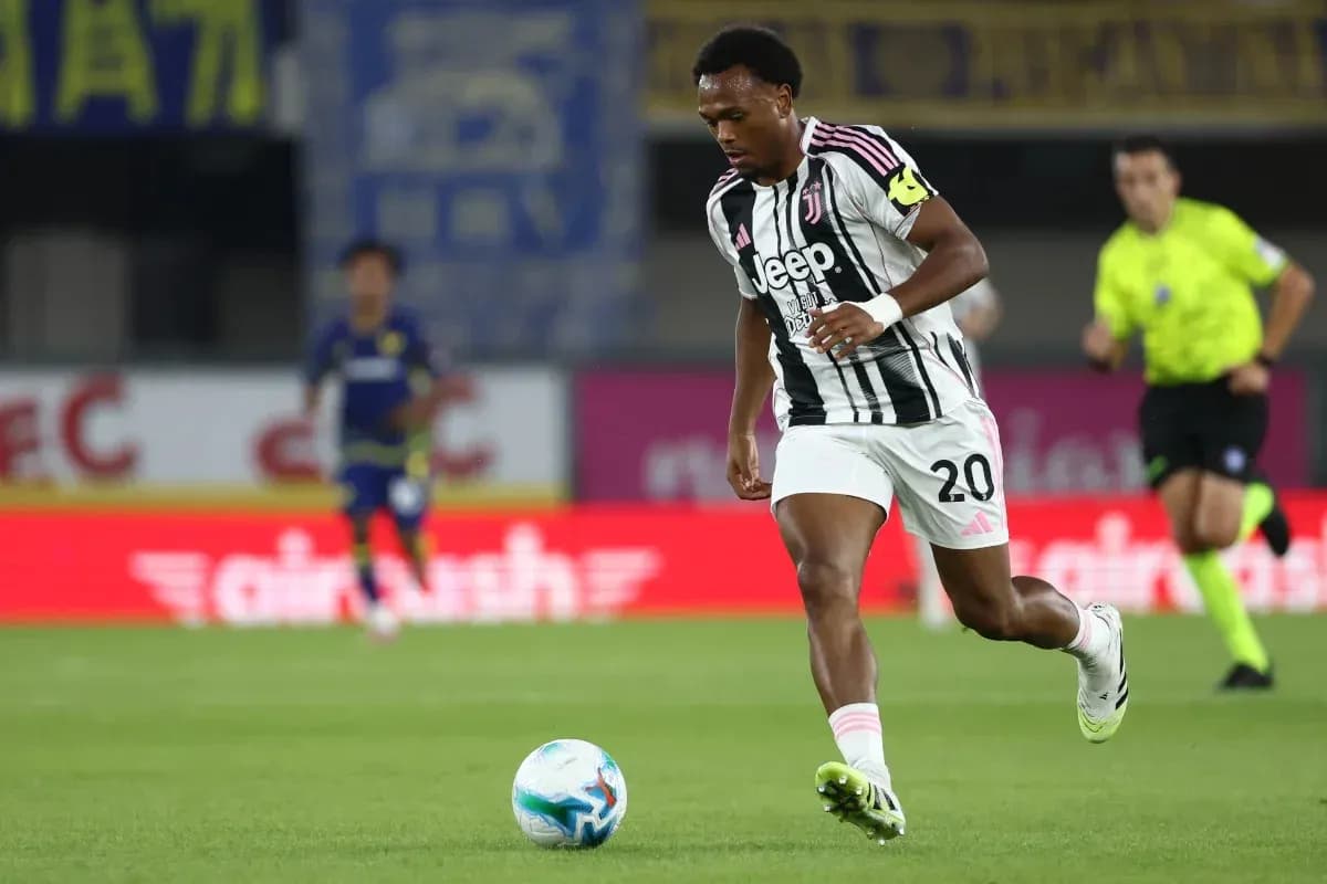 Juventus player dribbling the ball during match Juventus player dribbling the ball during match