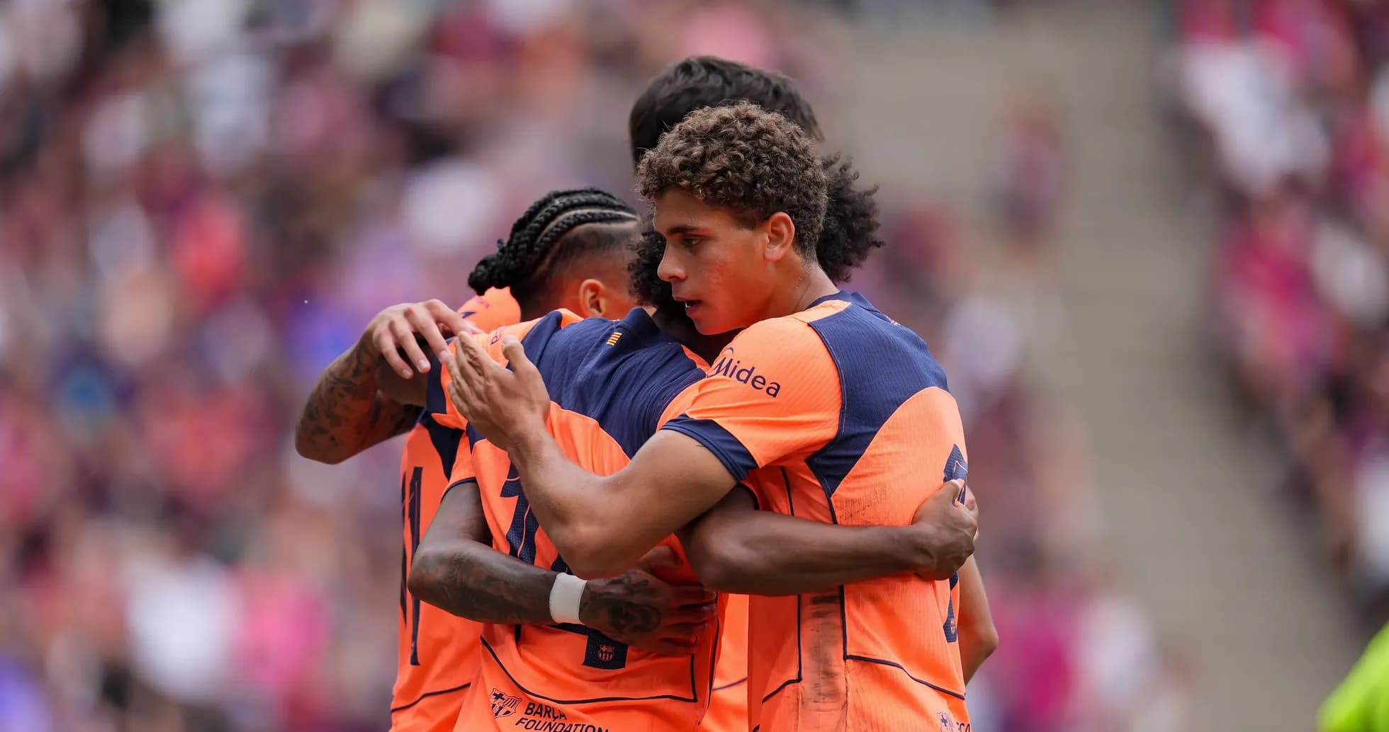 Players celebrating a goal during a match Players celebrating a goal during a match